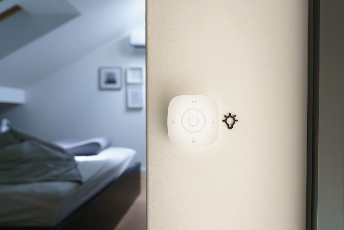 Smart home automation switch on a bedroom wall