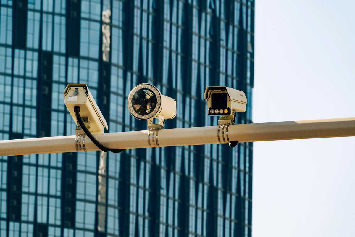 Surveillance cameras in front of a modern commercial building